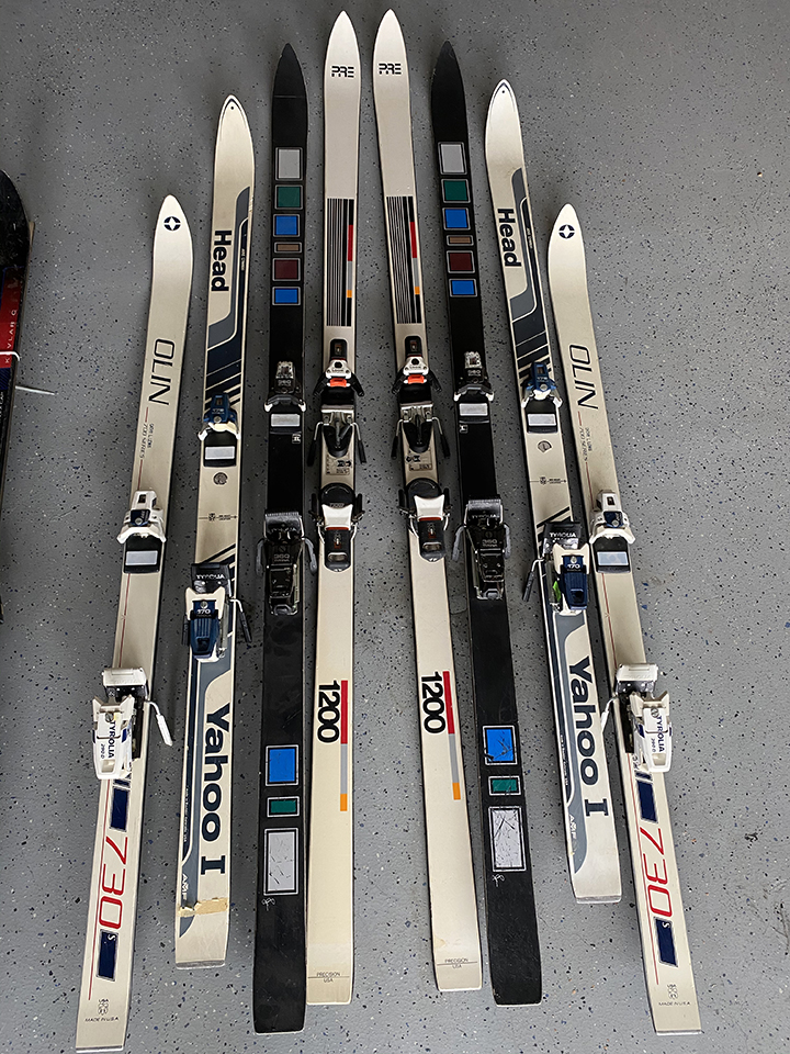 collection of old school skis on display as sample for colors and brands for custom ski chair